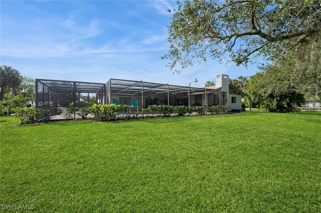 view of yard with a lanai