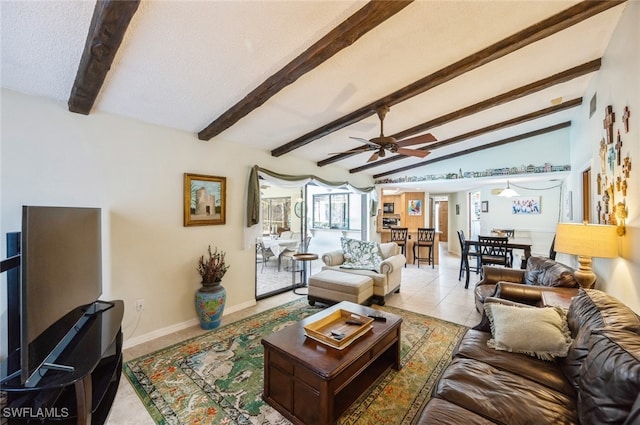 living room with lofted ceiling with beams, ceiling fan, light tile patterned flooring, and a textured ceiling