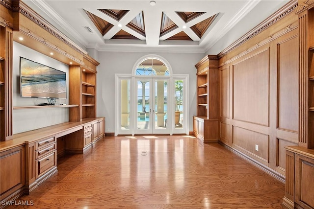 28790 Blaisdell Dr, Naples, FL 34119 - unfurnished office with built in study area, light wood-style floors, ornamental molding, beamed ceiling, and built in shelves