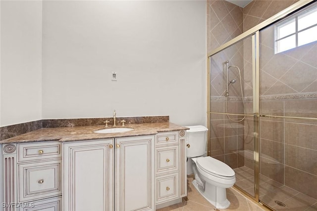28790 Blaisdell Dr, Naples, FL 34119 - full bath with a shower stall, toilet, vanity, and tile patterned floors