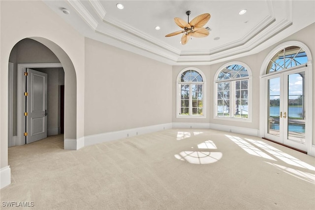 28790 Blaisdell Dr, Naples, FL 34119 - carpeted spare room with a tray ceiling, healthy amount of natural light, french doors, ornamental molding, and ceiling fan