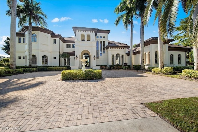 28790 Blaisdell Dr, Naples, FL 34119 - mediterranean / spanish-style house with curved driveway and stucco siding