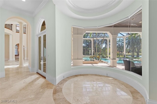 28790 Blaisdell Dr, Naples, FL 34119 - entrance foyer with ornate columns, baseboards, crown molding, french doors, and arched walkways