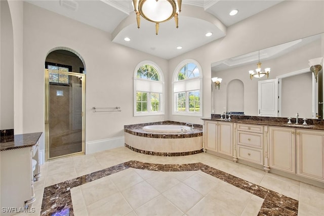 28790 Blaisdell Dr, Naples, FL 34119 - full bathroom featuring double vanity, a bath, a stall shower, a chandelier, and baseboards