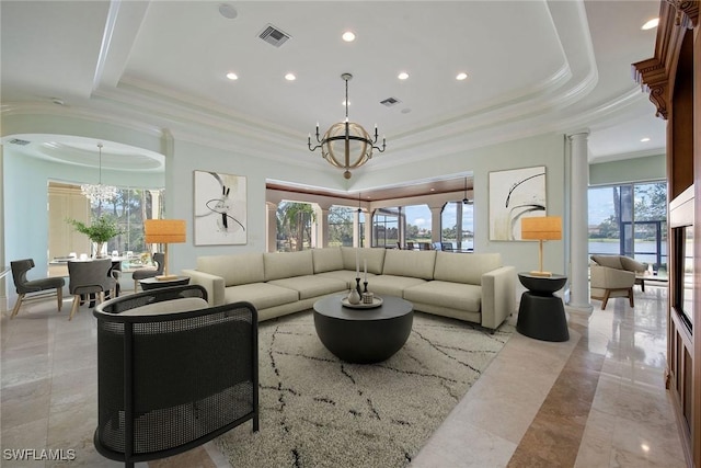 28790 Blaisdell Dr, Naples, FL 34119 - living room featuring a chandelier, a raised ceiling, ornamental molding, recessed lighting, and light marble finish floors