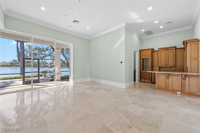 28790 Blaisdell Dr, Naples, FL 34119 - unfurnished living room featuring ornamental molding, baseboards, light marble finish floors, recessed lighting, and a water view