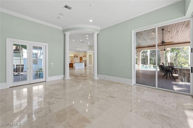 28790 Blaisdell Dr, Naples, FL 34119 - spare room featuring ornate columns, plenty of natural light, french doors, marble tiled flooring, and crown molding