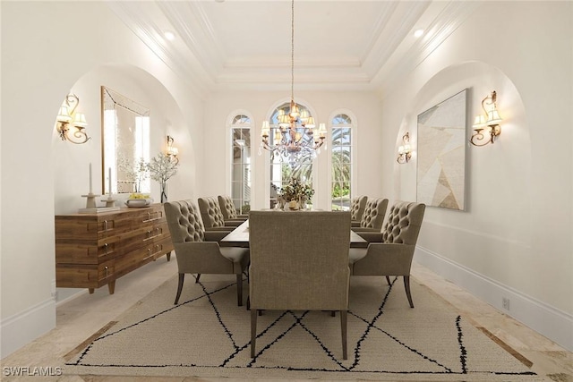 28790 Blaisdell Dr, Naples, FL 34119 - dining space featuring a chandelier, crown molding, a tray ceiling, baseboards, and arched walkways