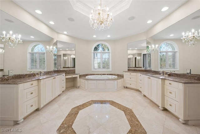 28790 Blaisdell Dr, Naples, FL 34119 - bathroom featuring a chandelier, inlaid floor details, recessed lighting, plenty of natural light, and two vanities