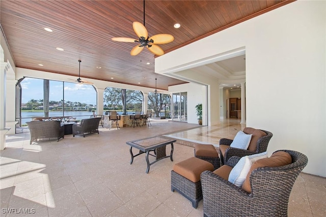 28790 Blaisdell Dr, Naples, FL 34119 - view of patio / terrace with an outdoor living space, a ceiling fan, outdoor dining area, and a water view