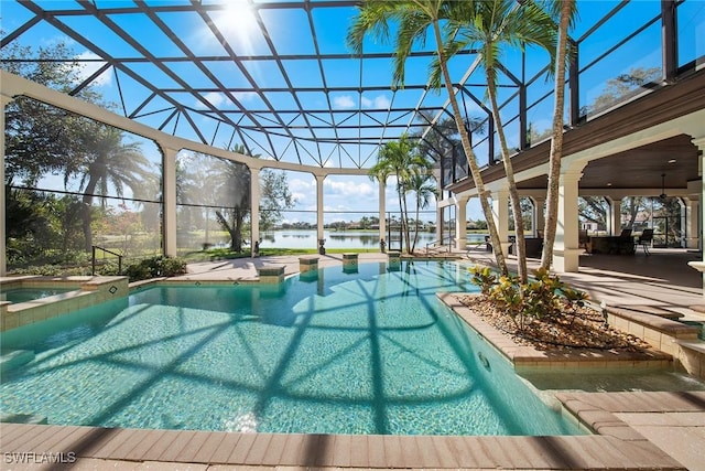 28790 Blaisdell Dr, Naples, FL 34119 - view of pool with a water view, a lanai, a patio, and a pool with connected hot tub