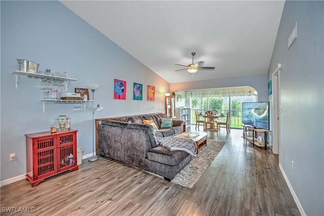 living room with ceiling fan, high vaulted ceiling, and hardwood / wood-style flooring