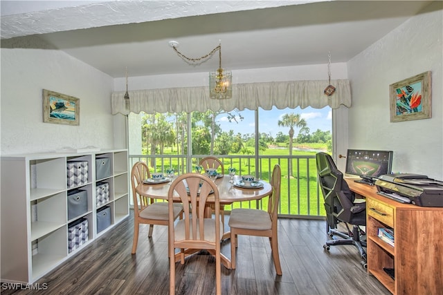 dining room featuring a chandelier and dark hardwood / wood-style floors