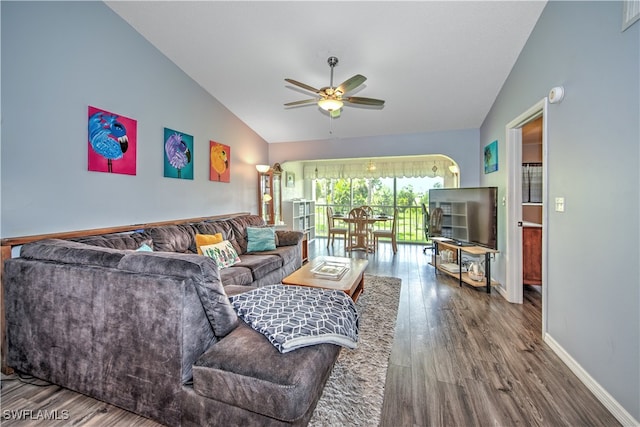 living room featuring hardwood / wood-style floors, ceiling fan, and lofted ceiling