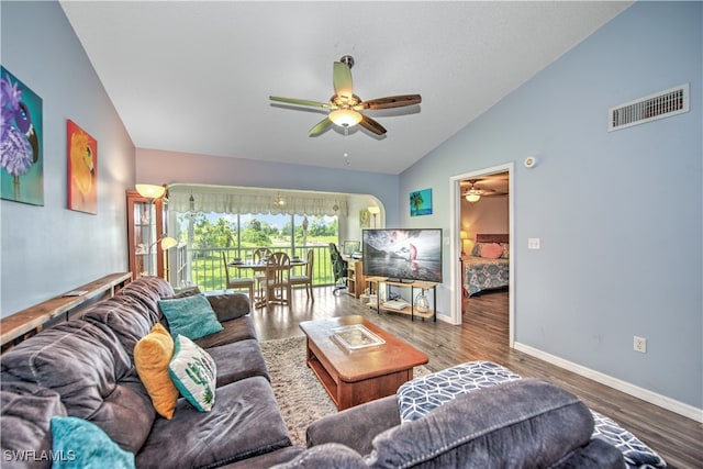 living room featuring ceiling fan, high vaulted ceiling, and wood-type flooring