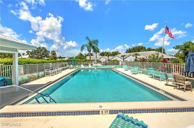 view of swimming pool with a patio