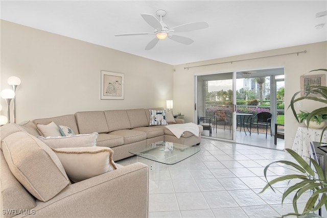 living room featuring light tile patterned floors and ceiling fan