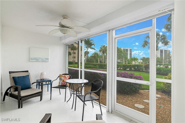 sunroom / solarium with ceiling fan