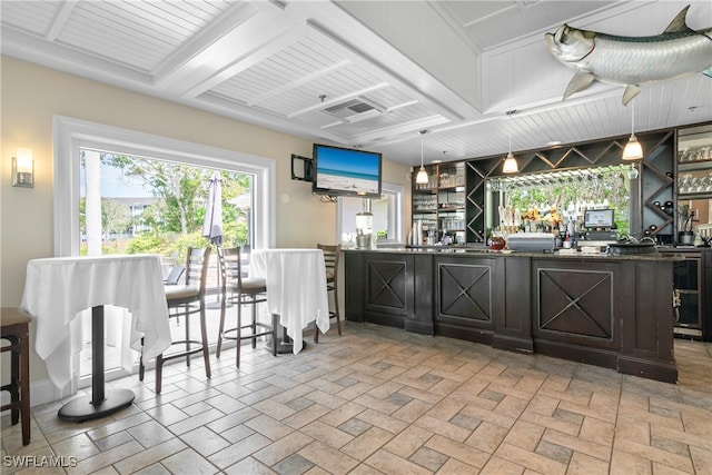 kitchen with a breakfast bar and pendant lighting