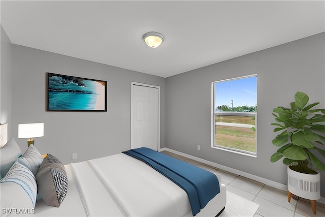 bedroom featuring light tile patterned floors