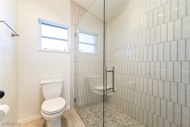 bathroom with toilet and walk in shower