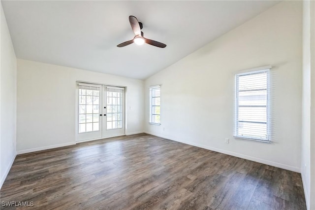 spare room with french doors, dark hardwood / wood-style flooring, vaulted ceiling, and ceiling fan