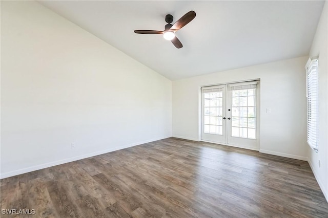 spare room featuring french doors, dark hardwood / wood-style floors, vaulted ceiling, and ceiling fan