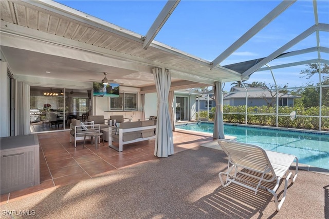 outdoor pool with a lanai, a patio, and an outdoor hangout area