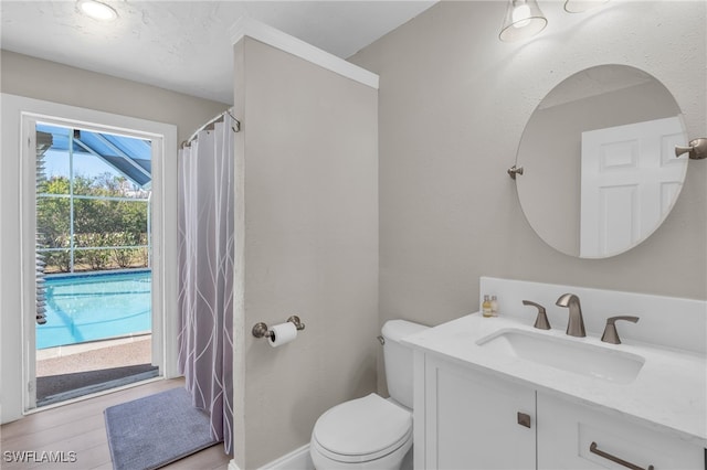 bathroom featuring hardwood / wood-style floors, vanity, and toilet