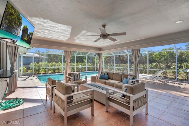 sunroom / solarium with ceiling fan and a healthy amount of sunlight