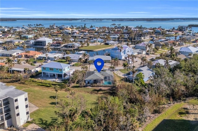 bird's eye view featuring a water view and a residential view