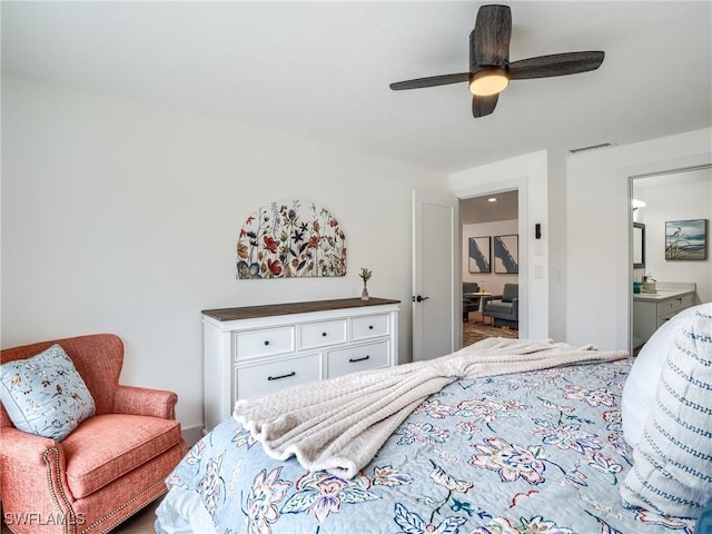 bedroom with ensuite bathroom and ceiling fan