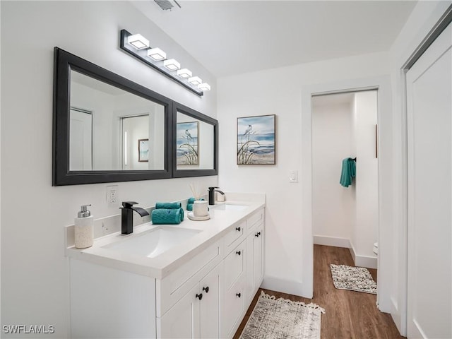 bathroom featuring vanity and hardwood / wood-style flooring