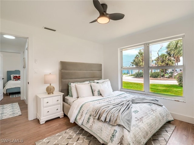 bedroom featuring ceiling fan and light hardwood / wood-style floors