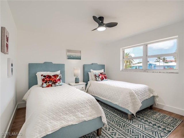 bedroom featuring hardwood / wood-style flooring and ceiling fan