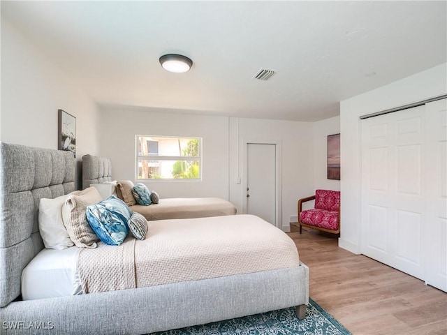 bedroom with light hardwood / wood-style floors