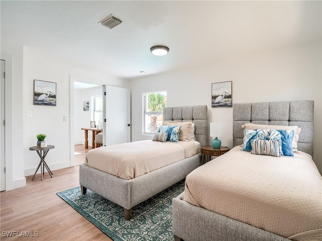 bedroom featuring wood-type flooring