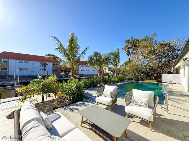 view of pool featuring outdoor lounge area and a patio area