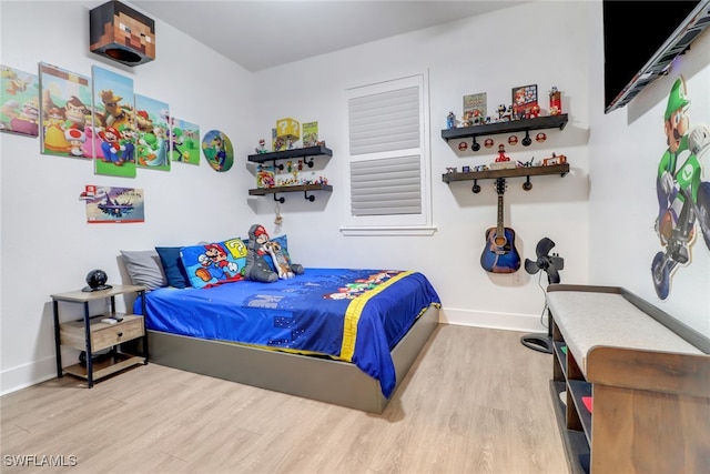 bedroom with light hardwood / wood-style flooring