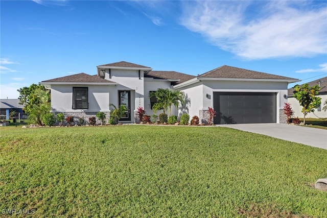 view of front of house with a front lawn and a garage