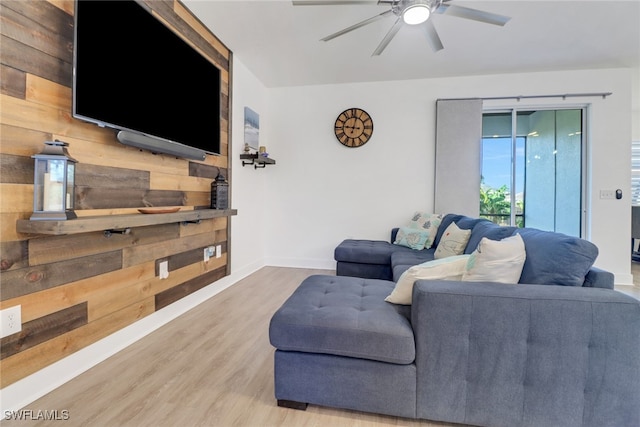 living room with ceiling fan and wood-type flooring