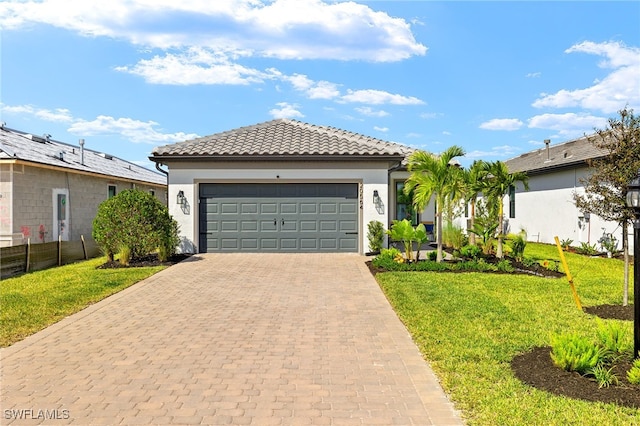 20564 Pebble Glen Dr, Estero, FL 33928 - mediterranean / spanish home featuring decorative driveway, an attached garage, stucco siding, and a tiled roof