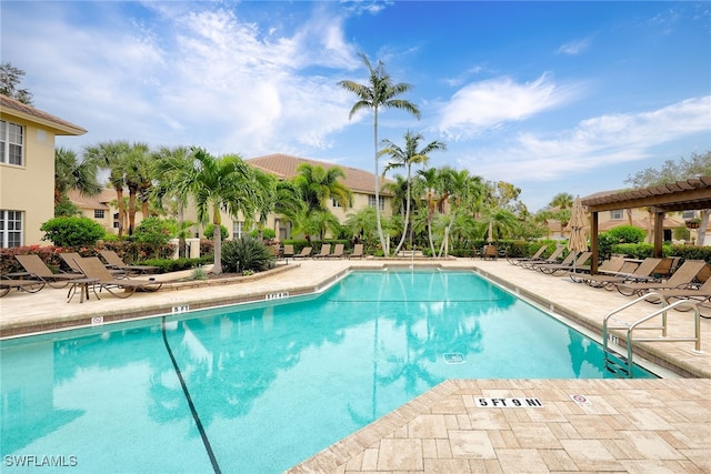 view of pool with a pergola and a patio