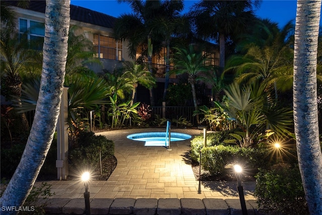 view of swimming pool featuring a community hot tub