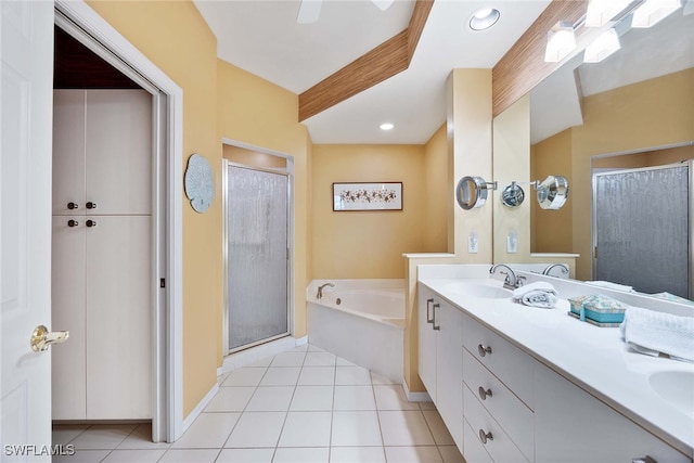 bathroom featuring tile patterned flooring, vanity, and separate shower and tub