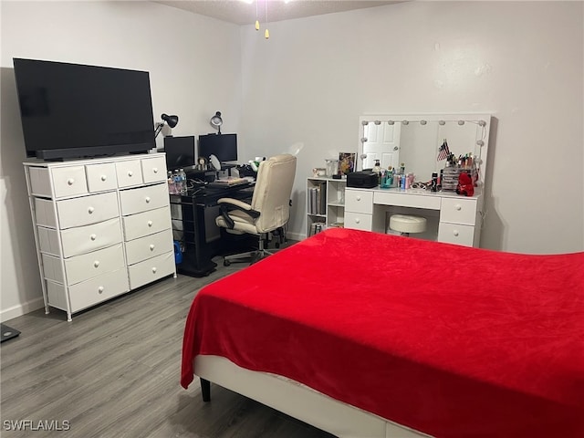 bedroom featuring wood-type flooring