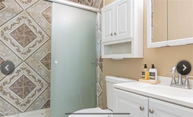 bathroom with vanity and toilet