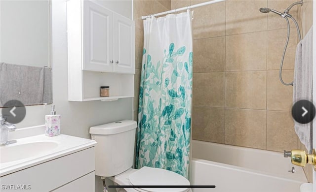 full bathroom with shower / bath combo with shower curtain, vanity, and toilet