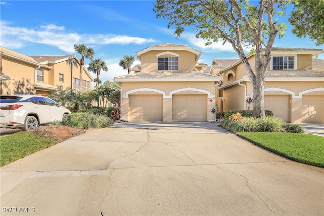 mediterranean / spanish-style home with a garage