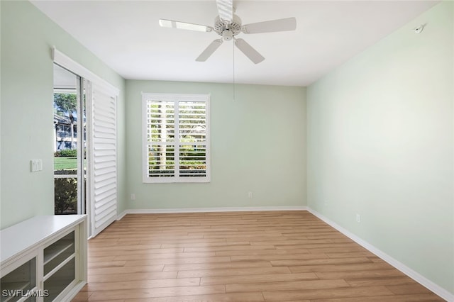 empty room featuring ceiling fan and light hardwood / wood-style floors